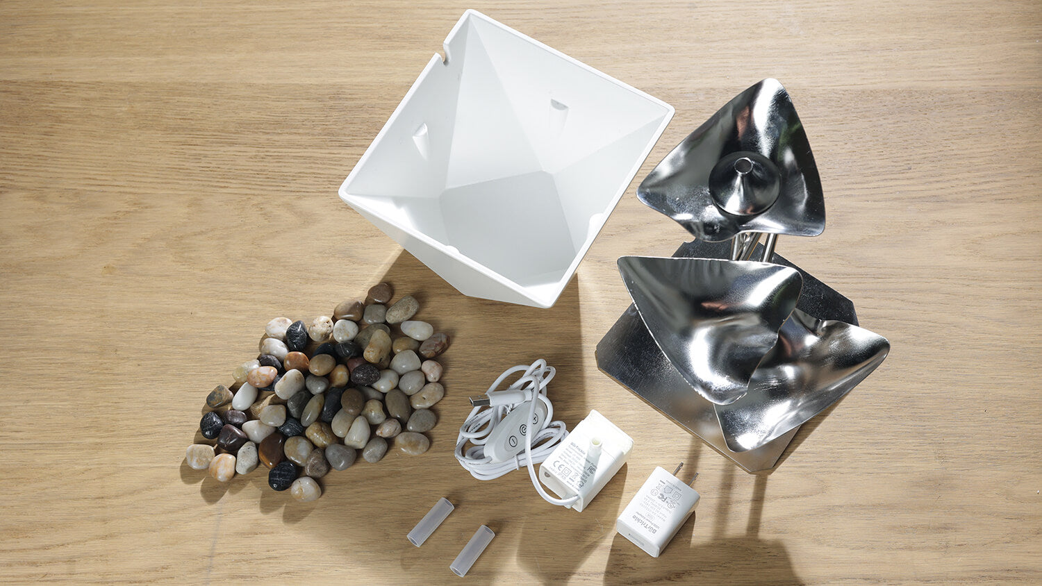 Load video: Including Fountain Top, Fountain Base, Water Pump, Power Adapter, Hose and River Rocks. Rinse these parts with clean water and wipe dry before use, except for electrical appliances.